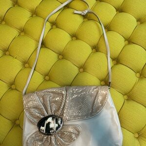 Vintage cream colored bag with (I believe) real snakeskin and shell! 80’s style